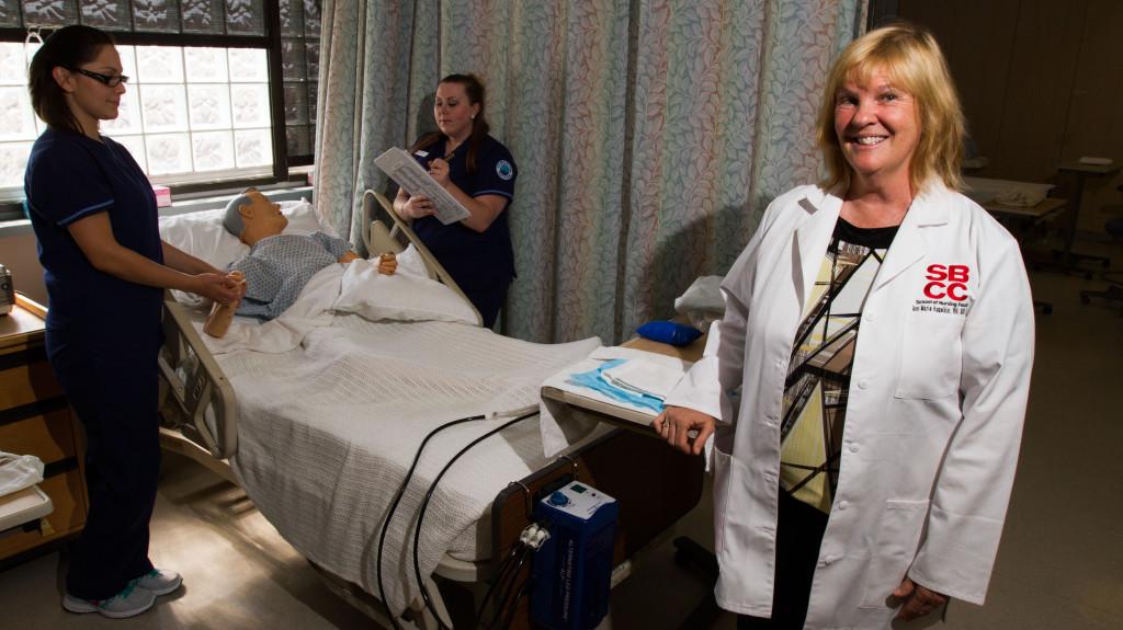 Channels File art of Ann Marie Kopekin with her students, Samantha Hernandez and Stephanie Davison, in the nursing department of the MacDougal Administration Building at City College.