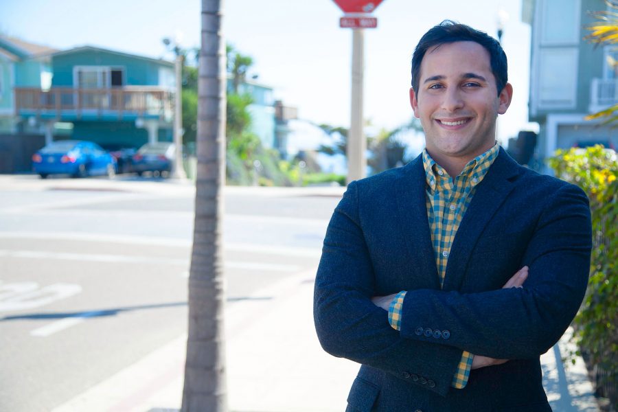 Jonathan Abboud, vice president of the Board of Trustees, on Thursday, March 16, in one of his favorite places in Isla Vista, at the corner of El Embarcadero Rd and Del Playa Road in Isla Vista. Abboud will attend the California Democrats State Convention this week to advocate for free college tuition.