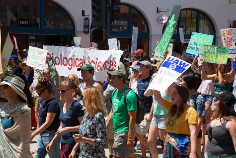 City College Biology Club walk down State street during the March For Science Day on Saturday, April 22, at De La Guerra Plaza in Downtown Santa Barbara.