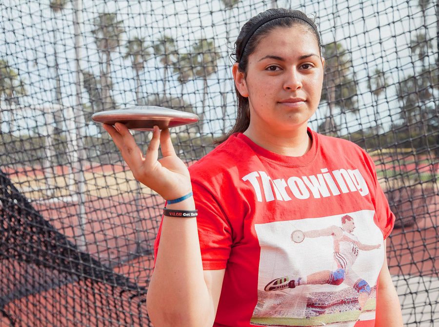 Freshman Alana Ochoa in front of the throwing cage with a discus on Monday, March 20, at La Playa Stadium. Ochoa won Javelin, shot put, discus and hammer at her very first College track meet.