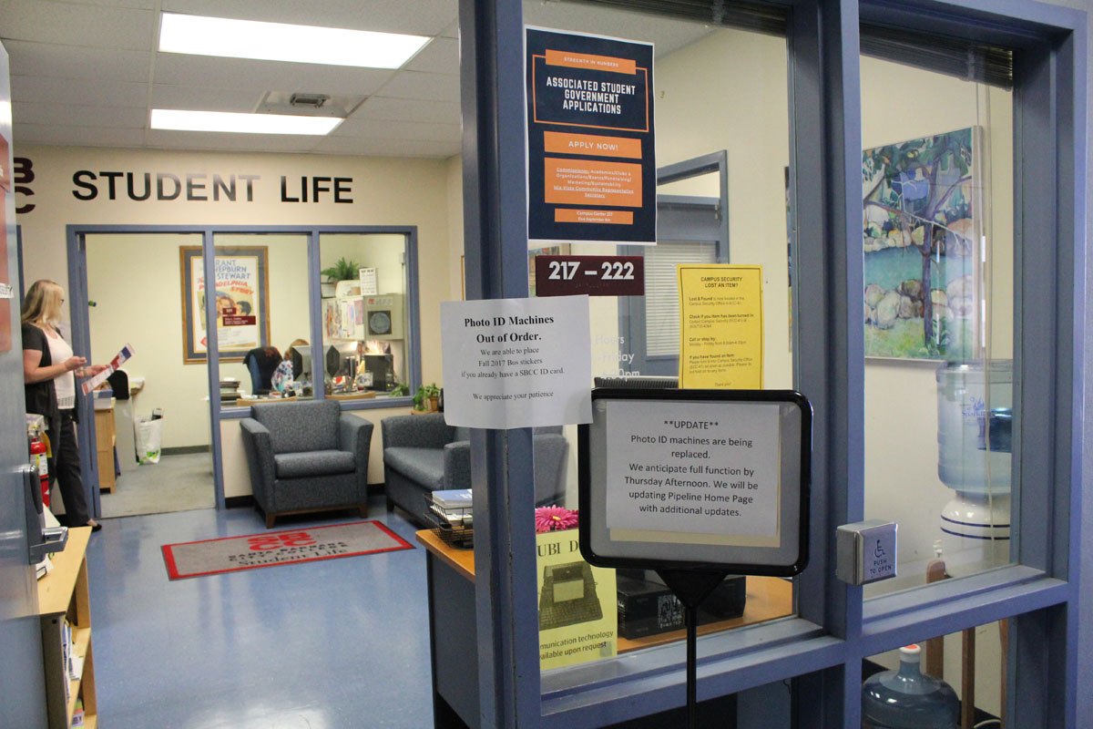 Signs informing students that student ID machines are broken the first week of school, Aug. 23, 2017, at the Office of Student Life at Santa Barbara (Calif.) City College. The office anticipates the machines to be fully functional by Aug. 24.