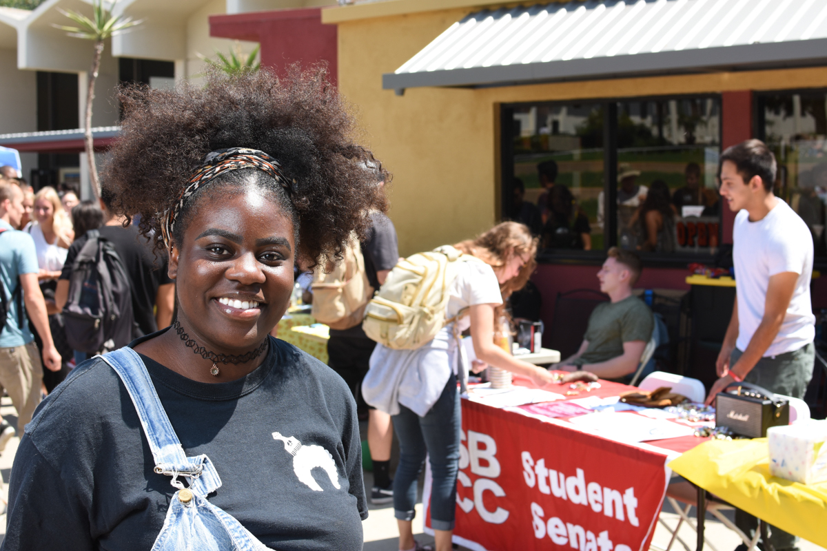 Saturne Tchabong, the team lead intern at Scheinfeld Center, staffs the table for the Black Student Union Club Thursday, Sept. 6 at the Friendship Plaza in Santa Barbara City College. Tchabong is the president of the club and was there recruiting students.