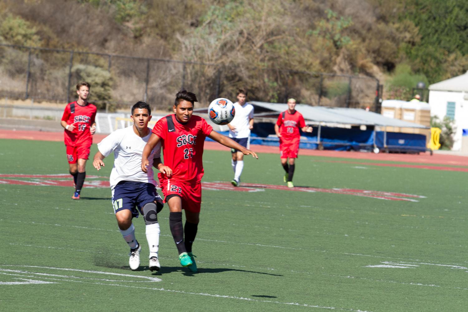 Midfielder Omar Cabanas fights for possession against Clovis College on Friday, Sept. 15, at La Playa Stadium at Santa Barbara City College. The Vaqueros tied the game 1-1.