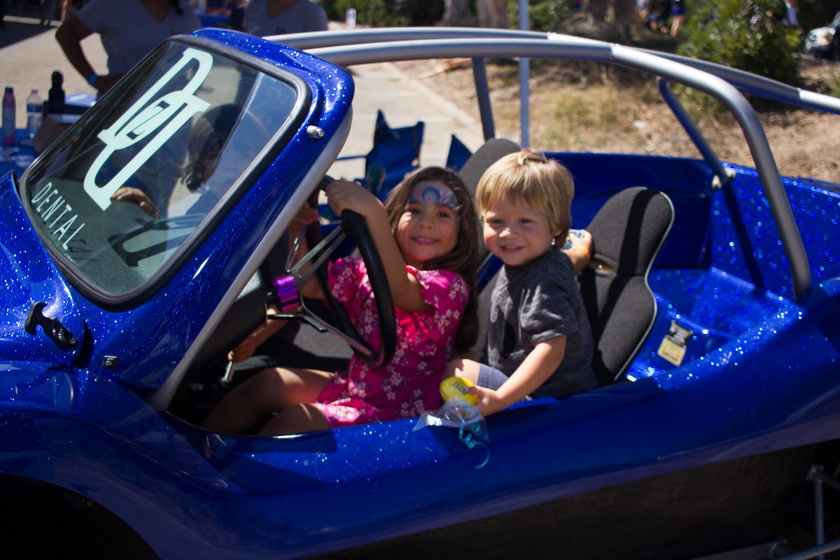 Giselle Guillen and Ezekial Karina sit a the wheel of a blue dune buggy during the annual Touch-A-Truck event Sunday, Sept. 24, 2017, at City College in Santa Barbara, Calif. All the machines on display were donated for the day by Postpartum Education for Parents program’s parent organizations.