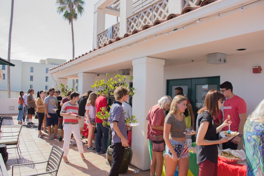 Students and staff line up to try cultural meals from different countries during the International Food Fair Friday, Oct. 13, at Antioch University in Santa Barbara, Calif. The event was free and had tables set up with meals from different countries including Italy, Sweden, Mexico, China, and more.