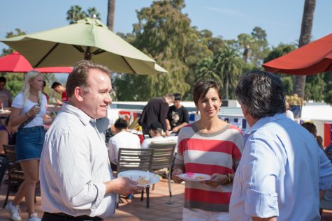 (From left) Brett Kia-Keating and Angela DeVita during the International Food Fair Friday, Oct. 13, at Antioch University's rooftop patio in Santa Barbara, Calif. Kia-Keating and DeVita are both faculty at the Antioch University.