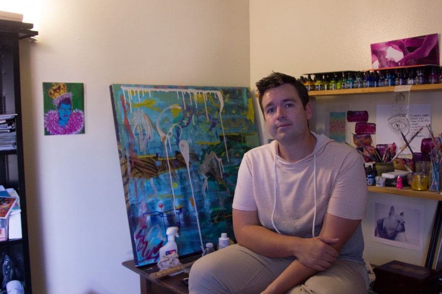 Bryan Austin Gillison posing next to his art in his studio Friday, Oct. 13, in Goleta, Calif. Gillison runs a sex-positive website called Boston Elements to promote his art.