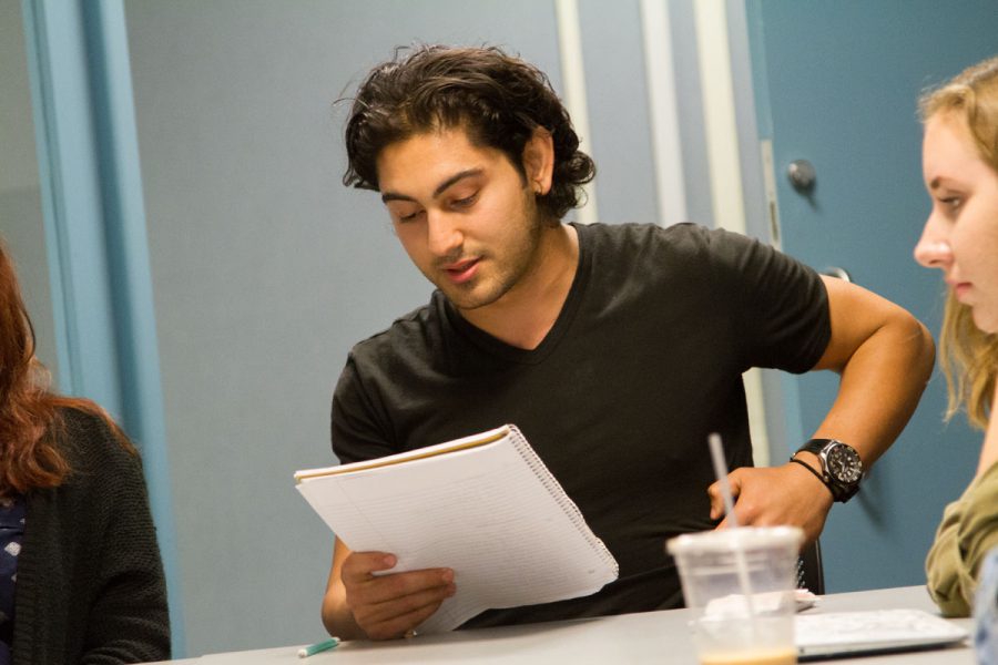 Club president Thane Justin Balayan reading his free write outloud to the club Thursday, Oct. 19, in the club room at the Campus Center. The freewrite was centered around the word soul and any words homonymous to it like sole.