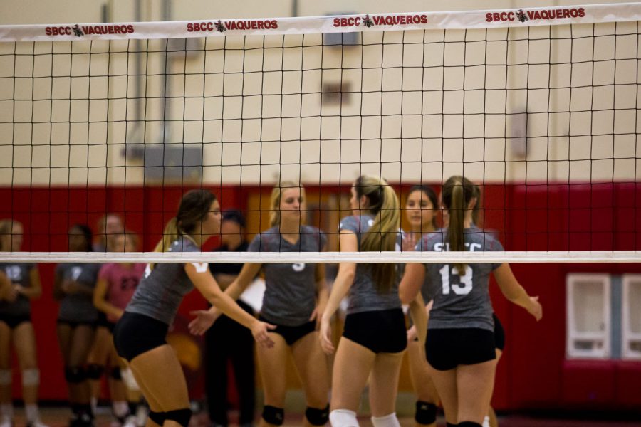 The Lady Vaqueros womens volleyball team huddles after a kill in a match against Cuesta College Wednesday, Oct. 25, at the Sports Pavilion. The Vaqueros swept the Cougars 3-0.