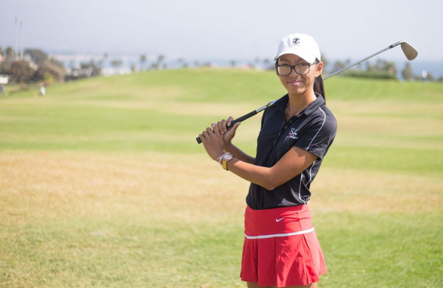 Vanessa Watkins Poses with her club, Thursday, Oct. 12 on the West Campus meadow. Watkins is a sophomore at SBCC and is a stand out player on the golf team shooting under 80 each match.