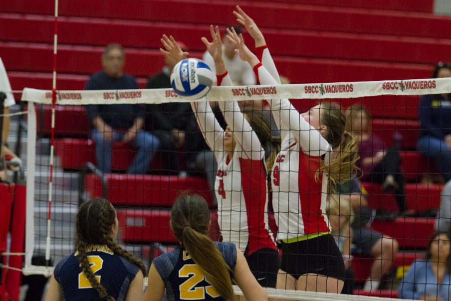 City College attacker Kaylene Ureno (No. 4) and outside hitter McKenzie Garrison (No. 9) successfully defend an attack from College of the Canyons as middle blocker Morgan Ferguson (No. 2) and setter Rachel Perez (No. 25) prepare for another attack Wednesday, Nov. 15, in the Sports Pavilion. The Vaqueros tied the second set at 17 after a block by Ureno.