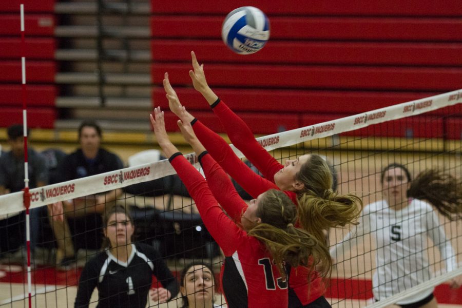 (Front center) City College Outside hitter Karissa Mertens (No. 13) and middle blocker Grace Trocki (No. 2) during their match against Moorpark College Friday, Nov. 3, in the Sports Pavilion. The Lady Vaqueros took the lead in the first game against the Raiders 25-17.