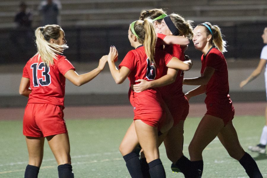 Lourdes Gilbert (center right) celebrates with her teammates after scoring her second goal of the night Saturday, Nov. 18, at La Playa Stadium. City College devastated Antelope Valley College 4-0 and will be playing Orange Coast College next Tuesday.