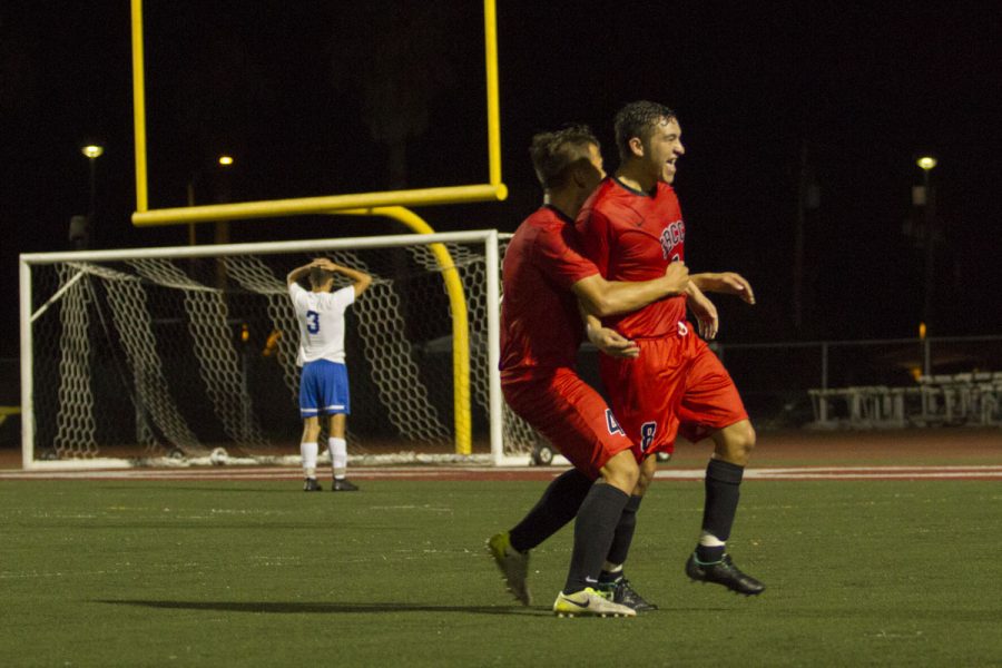 Jessie Jimenez (No. 8) and Andrew Wakamiya (No. 4) celebrating after Jimenez scored the Vaqueros’ second goal of the night against the Santa Monica Corsairs Thursday, Nov. 9, at La Playa Stadium. The Vaqueros won 3-2 making them undefeated in league.