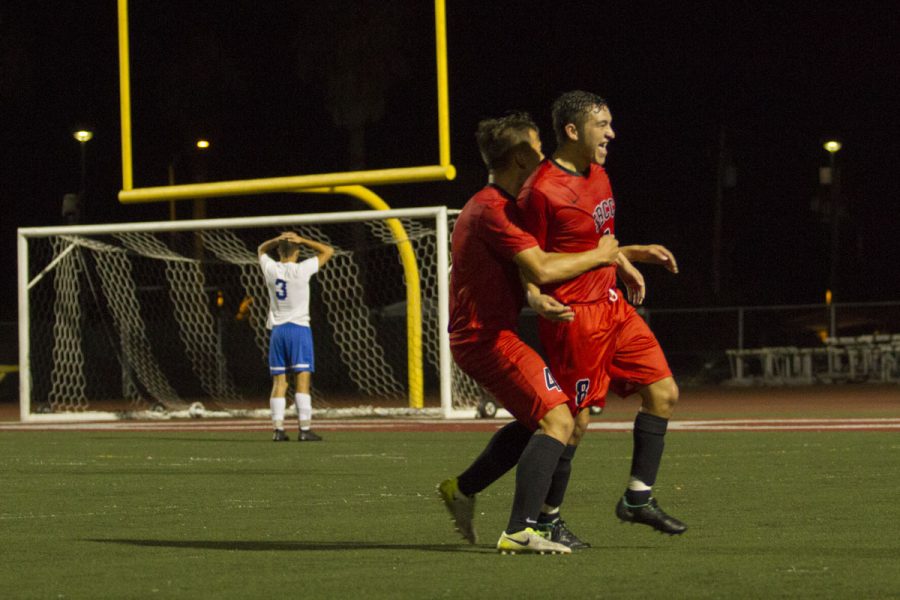 Jessie Jimenez (No. 8) and Andrew Wakamiya (No. 4) celebrating after Jimenez scored the Vaqueros’ second goal of the night against the Santa Monica Corsairs Thursday, Nov. 9, at La Playa Stadium. The Vaqueros won 3-2 making them undefeated in league.