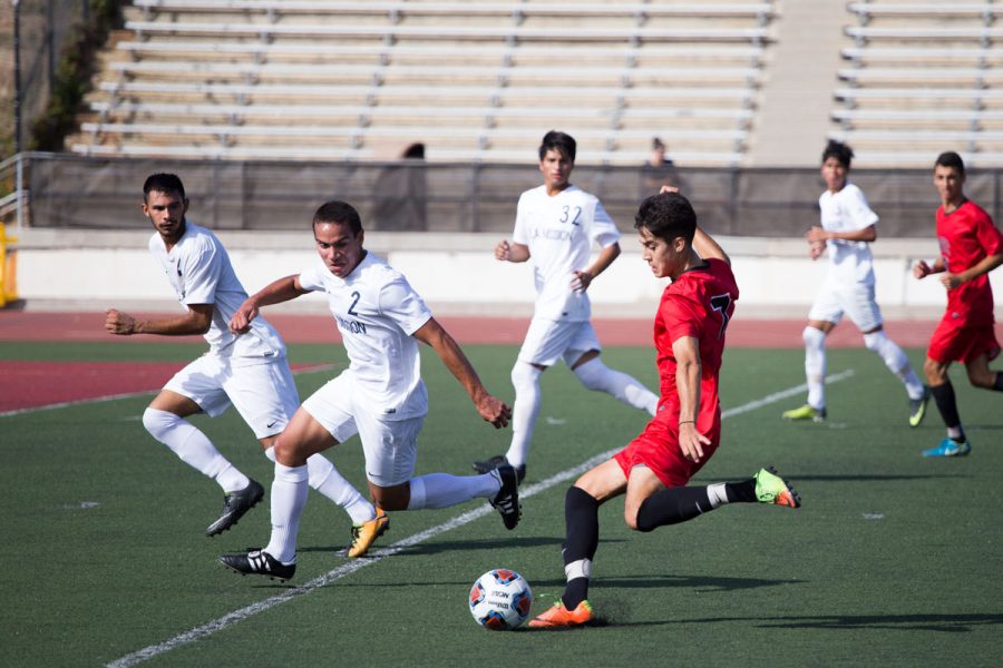 City College player Carlos Espinoza (No. 7) attempts to kick a goal Friday, Nov. 3, at La Playa stadium. The Vaqueros defeated LA Mission 4-1.