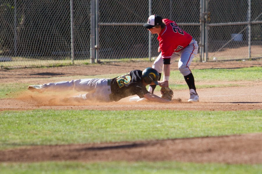 From right, Jake Holton, City College Vaqueros (no. 29) tags out Aaron Reardon, Napa Valley Storm (no. 12) on third base. The game was held at Pershing Park on Saturday, Jan. 27 in Santa Barbara.