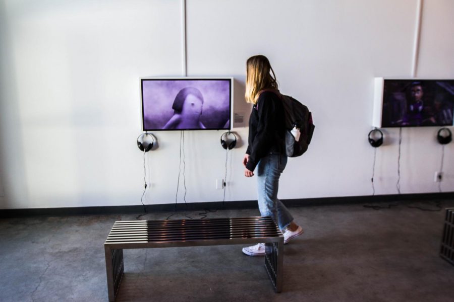 Hayze Law examines stop-motion films at the Atkinson Gallery at Santa Barbara City College on Thursday, Feb. 15. The exhibition, ‘Girlhood’ features work from Rita Basulto, Laura Krifka, Heidi Kumao, Kirsten Lepore, and Suraya Raj.
