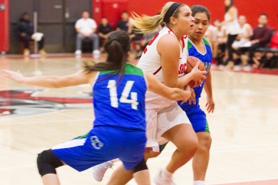 Vaquero Aaliyah Pauling (no. 32) goes for a layup while Maxine Holguin (no. 14) and Airin Lara (no. 1) from Oxnard College attempt to block her. The game was held at the Santa Barbara City College Sports Pavilion on Wednesday, Feb. 7. The City College Vaqueros beat the Oxnard College Condors 79-42.