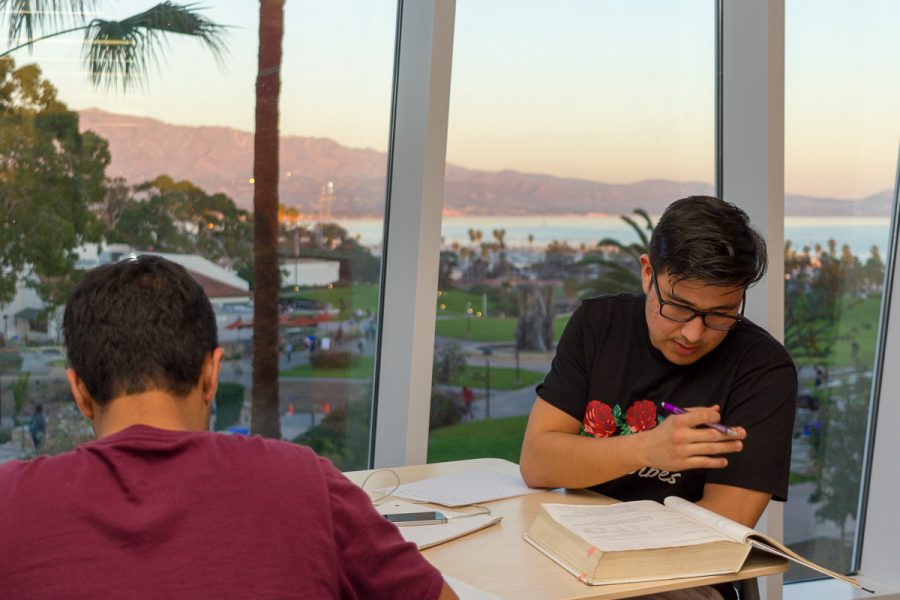 Rubin Gonsalves, in burgundy, and Eduardo Fabian, wearing black, study in the new West Campus Classrooms Building at Santa Barbara City College, on January 31. The new building offers an open study space for students to enjoy the views throughout the day.