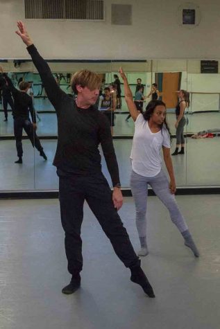 Tracy Kofford demonstrates techniques in posing with Camara Byrd in the Physical Education Building Room 113, at Santa Barbara City College on Friday, Feb. 23. Kofford routinely shows the dancers in his group little improvements they can make to their form to prepare them for competition.