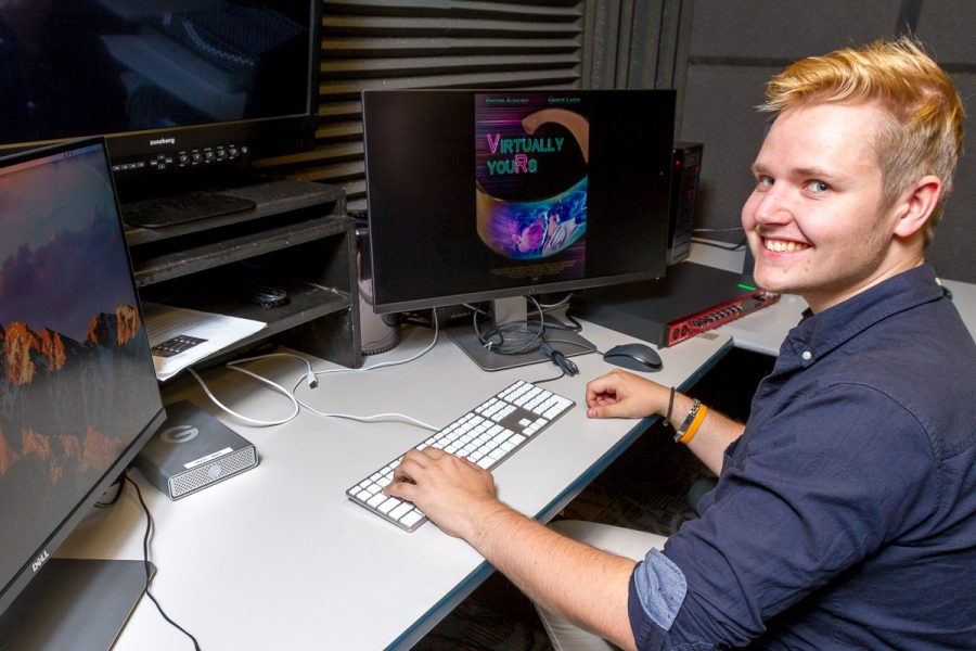 Victor Sjölin works in a capstone editing studio inside the Humanities Building Room 231 at Santa Barbara City College on Jan. 31. Sjölin works on the promotional poster for the film ‘Virtually Yours’. The film will be debuting at the Arlington Theater in Santa Barbara on Monday, Feb. 5.