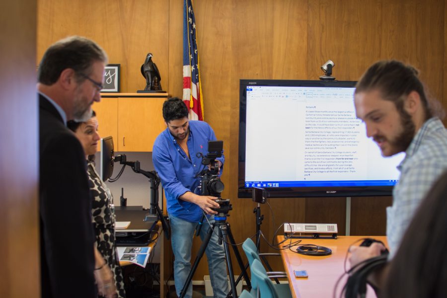 Osiris Castaneda (center), gets the camera ready as Devin Green (right) sets up the microphone to film City College’s Superintendent/President Anthony Beebe (left) saying a few words to those affected by the Thomas Fire and Montecito mudflow, and a thank you to the fire fighters.