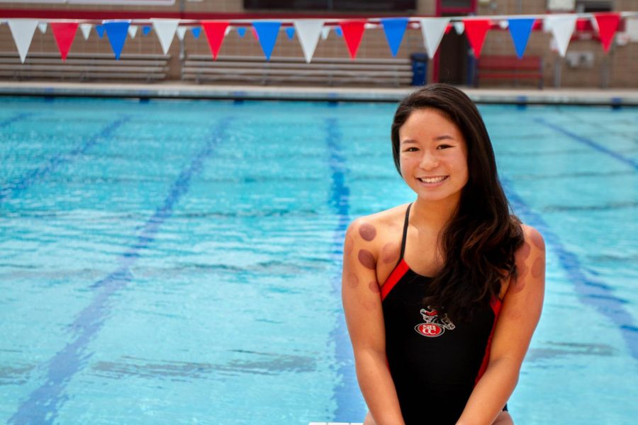 Kelee Shimizu, a freshman swimmer at Santa Barbara City College, competes in the freestyle for the Vaqueros who practice at the San Marcos High School pool. Shimizu uses cupping therapy to relieve muscle tightness before meets.