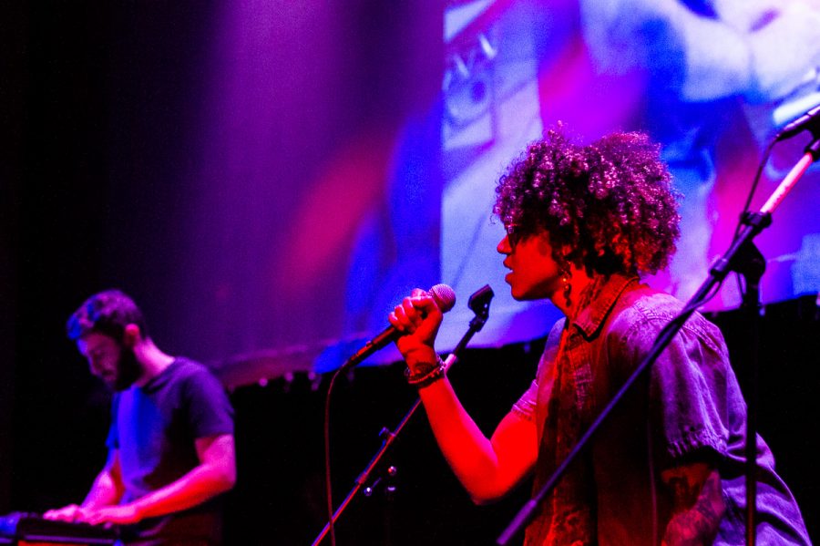 Vocalist Sarah Jackson performs alongside Gabriel Lawson, who uses a synth bass with a computer for a song titled “June Bloom” at the Garvin Theatre on Thursday. Lawson and Jackson performed with a giant projector showing the audience different angles of their performance.