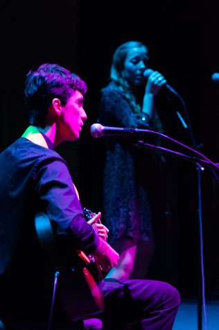 Kellen Romano (left) and Ginger Brucker perform an acoustic cover of The Beatles’ classic “While My Guitar Gently Weeps,” at the Garvin Theater on Thursday.
