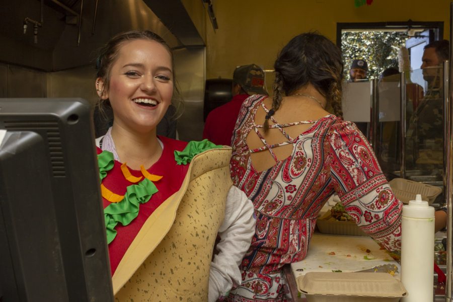 Rachael Young, a cashier at Favela cafe says she is moving through orders faster than usual as a rush of customers come through to support the Favela cafe on its last day of operation on Thursday, April 26, 2018, at Santa Barbara (Calif.) City College.