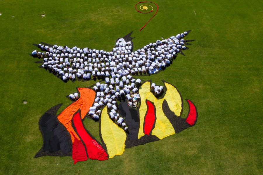 Community members join together to create a dove rising from flames at the Rising Together event on Saturday, April 21, at Santa Barbara City College. Nolan Barickman, a local firefighter, took a camera over 100 feet in the air on a ladder from a city fire truck to capture this image.