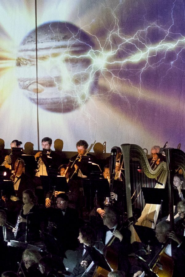 The planet Jupiter is displayed on screen while the orchestra performs Gustav Holsts The Planets.This was the first time the music department used projected visuals for an orchestra performance.