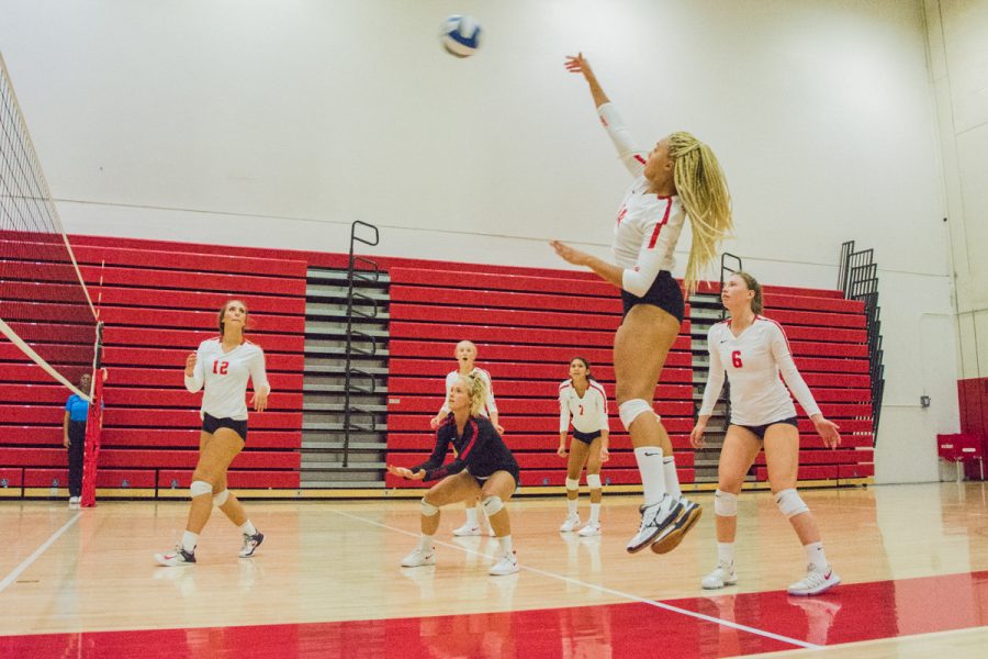 City College opposite hitter, Jazz Hill (No. 14), hits the ball at the Sports Pavilion Gym in Santa Barbara, Calif., on Saturday, Sept. 15, 2018 Hill helped the Vaqueros score in their 25-6 set win.