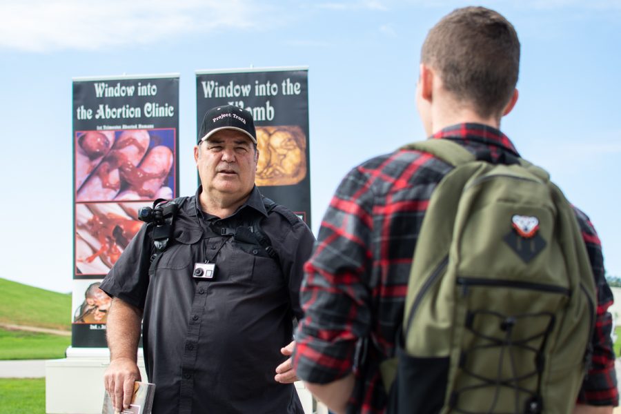 Don Wilberforce (left) speaks with Kenyon Newhouse about abortion outside his booth at the West Campus at City College in Santa Barbara, Calif., on Monday, Oct. 1, 2018. Wilberforce is part of the pro-life group Project Truth, which aims to “educate students on the injustices of abortion”, according to one of the members.