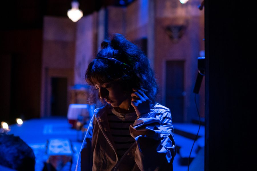 Stagehand Katlyn Villalobos waits for the go-ahead from the stage manager to return to her mark and get ready to move a piece of the set between acts on Saturday, Oct. 6, 2018 at City College in Santa Barbara Calif.