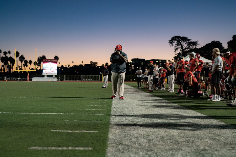 Defensive coach Don Willis waits on the side lines as the athletic trainers and head coach take the field to check on Tamir Walker (No.23) after a hard collision on Saturday, Oct. 20, 2018, at La Playa Stadium at Santa Barbara City College, in Santa Barbara Calif. L.A. Harbor defeated City College 17-14.