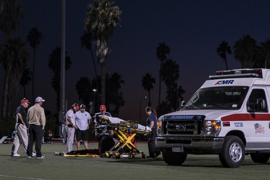 Tamir Walker (No. 23) lays injured on the field as the medical team addresses his injuries and prepares to load him into the ambulance on Saturday, Oct. 20, 2018, at La Playa Stadium at Santa Barbara City College, in Santa Barbara Calif.