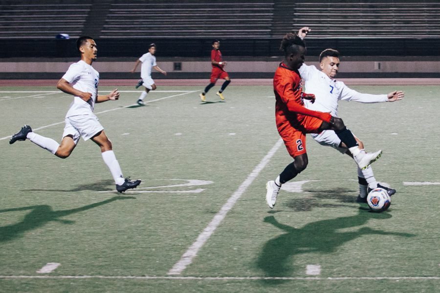 City College midfielder Ameyawu Muntari (No. 2) fights for the ball against Allan Hancock College's midfielder Daniel Romero (No. 7) at La Playa Stadium in Santa Barbara Calif., on Tuesday, Oct. 9, 2018.