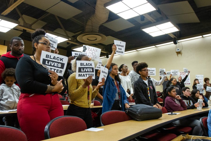 City College students and Black Student Union members hold “Black Lives Matter” and “I Support This Speaker” signs during a Board of Trustees meeting on Monday, Nov. 19, at the Administration Building at City College in Santa Barbara, Calif. They hold the signs in protest of Lyndsay Maas’ use of the N-word in the Gender Equity Work Group meeting, which she said in reference to a racist comment made by a student towards a black student.