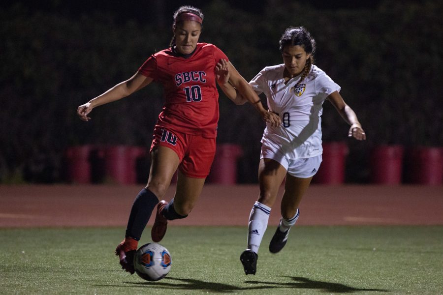 Lady Vaqueros Lourdes Marin-Rodriguez (No. 10) drives the ball through the Mesa’s defense during the first playoff game on Saturday Nov. 17, at La Playa Stadium at City College, Santa Barbara, Calif. City College went on to win, 3-1.