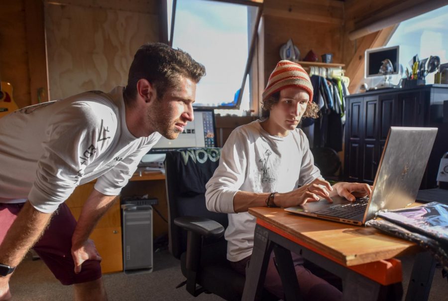From left, City College graphic design and business major Adam Verhasselt, 20, and graphic design major Will Young, 18, work on designs for their clothing line, Vlux Visual, on Wednesday, Nov. 7, 2018, at a digital printing lab in the Funk Zone in Santa Barbara Calif. Vlux Visual is a limited edition Artwear brand that supports growing artists.
