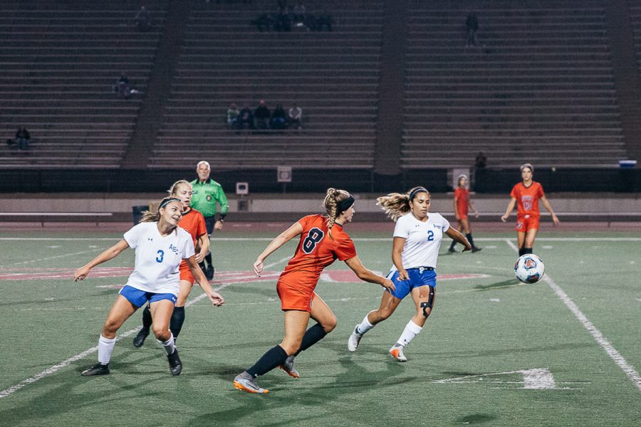 Lady Vaqueros defense Nicole Van Sickle (No. 8) races Allan Hancock midfielders Sienna Ramirez (No. 3) and Tatiana Silva (No. 2) for control of the ball on Tuesday, Nov. 6, at La Playa Stadium at City College in Santa Barbara, Calif. Van Sickle scored the second goal of the game during the first half.