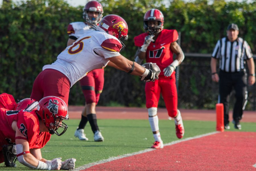 Chase Elliott (No. 35) and the rest of the Vaqueros defense fail to stop the Lancer, Salman Gurung (No. 26), in a two-point conversion giving them the lead Saturday afternoon on Nov. 10, 2018, at La Playa Stadium in Santa Barbara, Calif. City College were given a two yard penalty for having too many men on the field, giving Pasadena City College better field position to convert the two-point conversion, which resulted in the difference of the game.