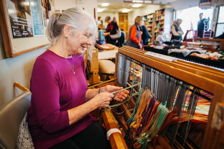 Charlotte Gould passes thread through a loom to weave a rug for her home on Saturday, Dec. 1, 2018, at the School of Extended Learning Wake Campus in Santa Barbara, Calif. Gould has been sewing and weaving for eight years.