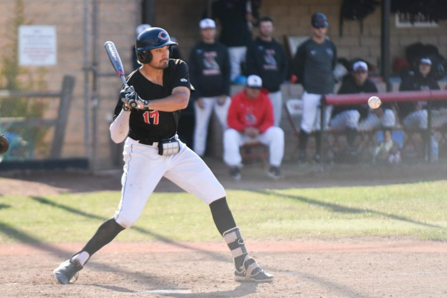 Eddie Pietschmann (No. 17) eyes the ball before hitting It on Feb. 23, 2019, at Pershing Park in Santa Barbara, Calif The Vaqueros lost 11-8.