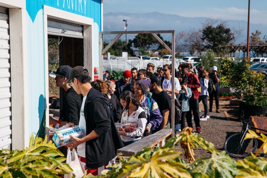 Santa Barbara City College students line up to receive their free items from the Food Pantry on Wednesday, Jan. 30 in front of the pantry on the colleges East Campus. The Pantry staff said they worked quickly and efficiently to make the line move as fast as possible.