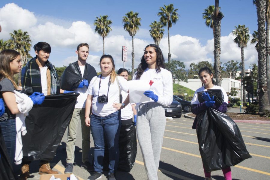 Layla Tondravi, a member of the leadership group of SBCC’s Phi Kappa Theta Honors Society, speaks to a group of students gathered to participate in a beach clean up event March 9, 2019, at Leadbetter Beach Park in Santa Barbara, Calif.