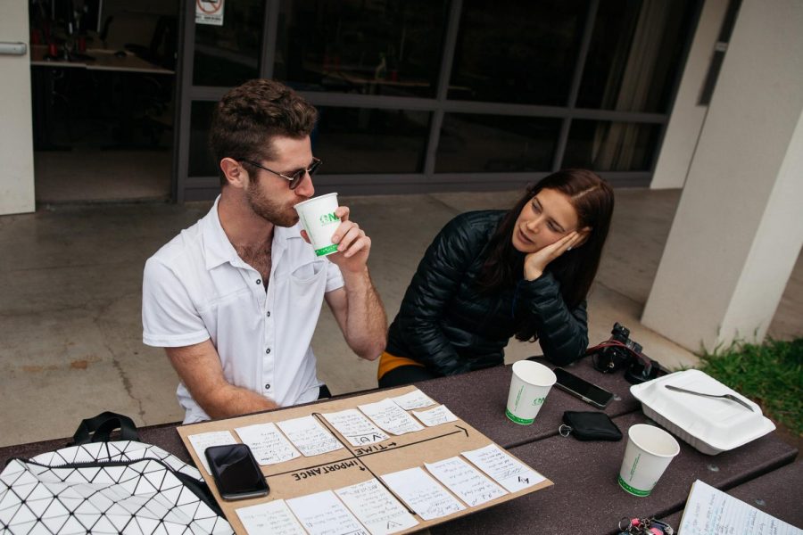 Adam Verhasselt and Gaia Menni discuss future goals and ideas over coffee during the Creative Club meeting on Friday, March 1, 2019 in front of the Occupational Education building at City College in Santa Barbara, Calif. The club meets every Friday at noon.
