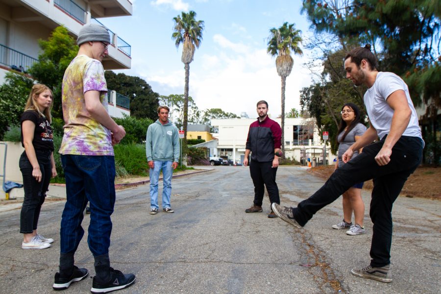 President of the Hacky Sack Club Ben Early, right, kicks the footbag while the other members, from left, Alex Sasich, Elijah Akia, Dylan Rief, Taji Tanner, and Rocio Reyes get ready for the ball to be passed around outside the Earth and Biological Sciences Building on Thursday, March 21, 2019, at City College in Santa Barbara, Calif. The Hacky Sack Club meets 4 p.m. on Thursdays.